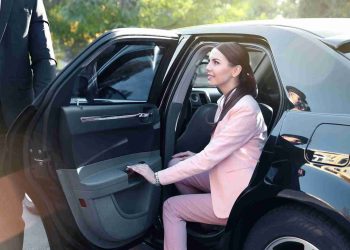 Businesswoman in luxury car