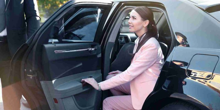 Businesswoman in luxury car